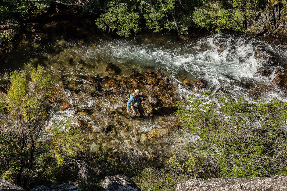 Flyfisherman wading Rio Manso Argentina