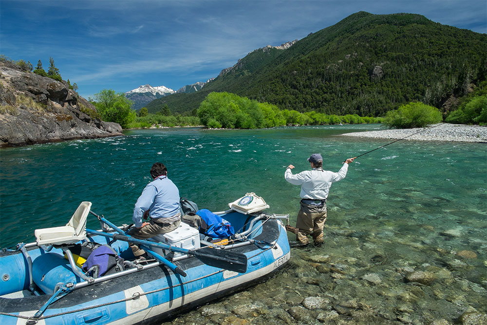 Fly fishing Argentina's Rio Manso River with Andes in Background